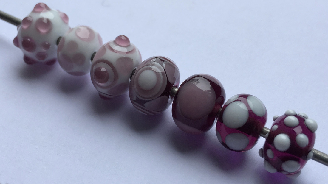 Glass beads showing different dotty patterns